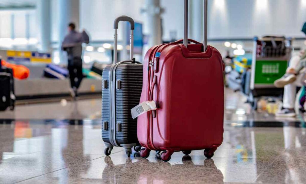 Two Fully Packed Checked Suitcases